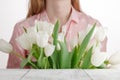 Girl with a bouquetÃâ°ÃÂ° tulips bestowed